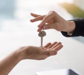 Real Estate Agent Giving Keys to Owner