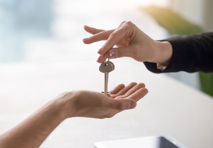 Real Estate Agent Giving Keys to Owner