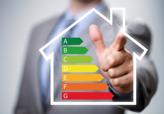 Businessman pointing to energy chart